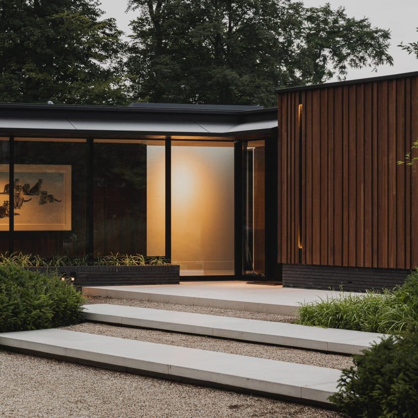 Thermo-ash cladding gives tone and texture to Dutch forest house