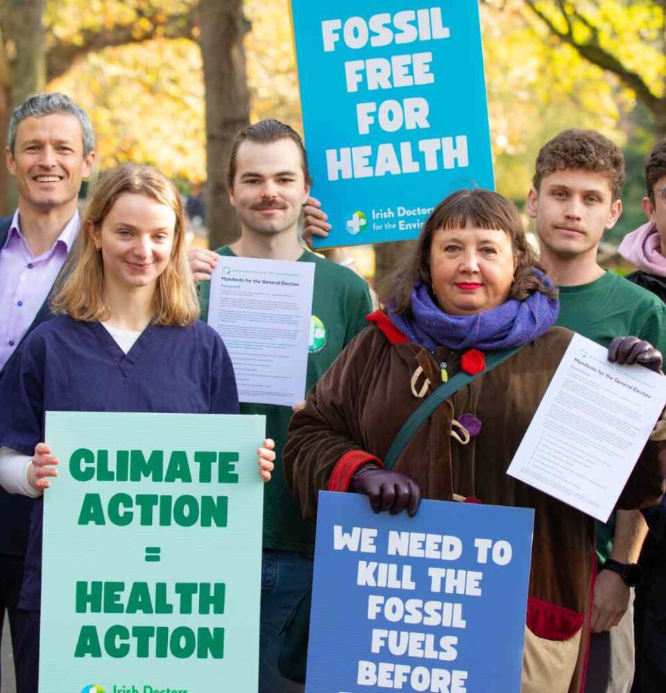 Members of Irish Doctors for the Environment holding signs which read 'Fossil free for health' and 'Climate Action = Health Action'.